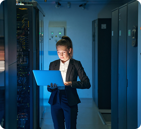 Engineer reviewing infrastructure in a server room
